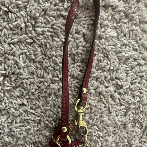 Preloved Coach Maroon Wristlet with Circular Design - Picture 2 of 5